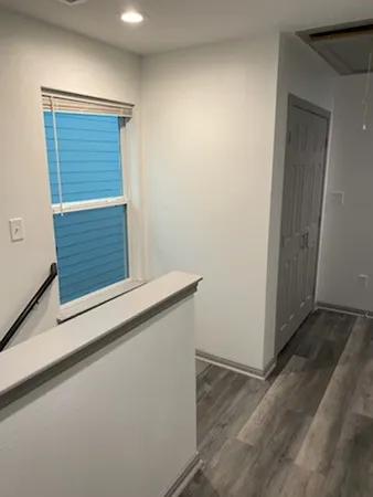 a view of front door with wooden floor