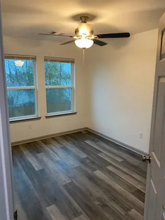 a view of an empty room with a window