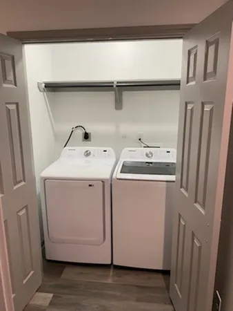 a utility room with dryer and washer
