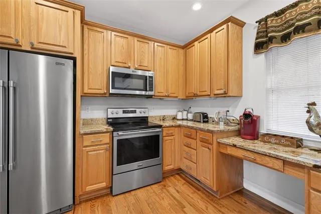 a bathroom with a double vanity sink a mirror and a bathtub