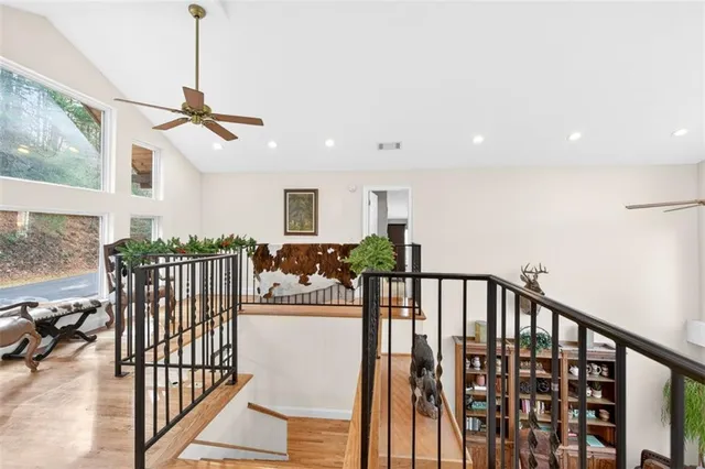 a living room with furniture a table and chairs with kitchen view