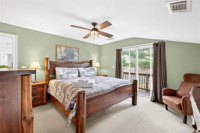 a kitchen with sink a refrigerator and wooden cabinets