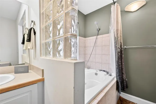 a view of a house with a yard and garage