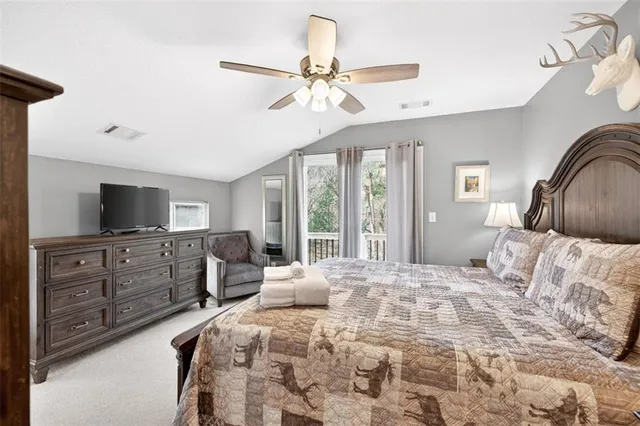 a front view of a house with a yard and balcony
