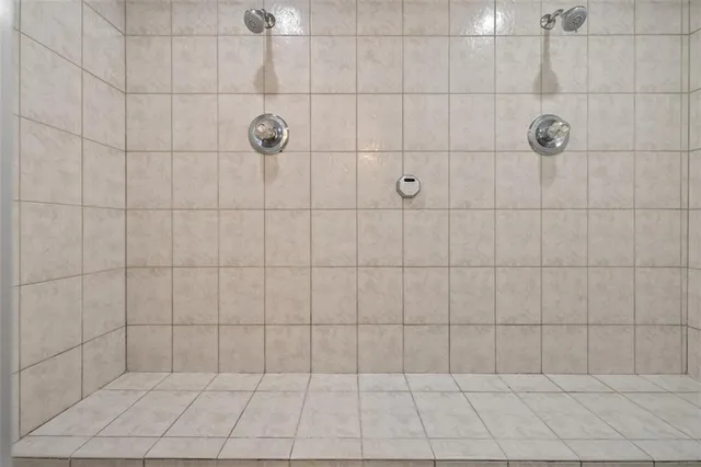 a view of a brick building next to a yard