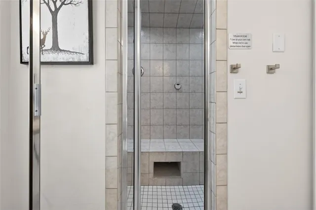 an aerial view of a houses with a swimming pool