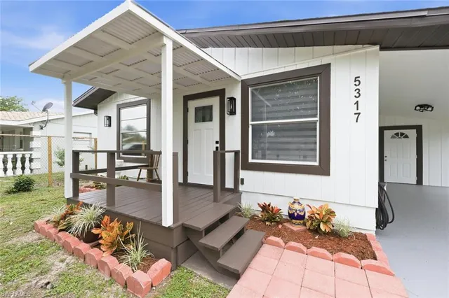 a front view of a house with patio