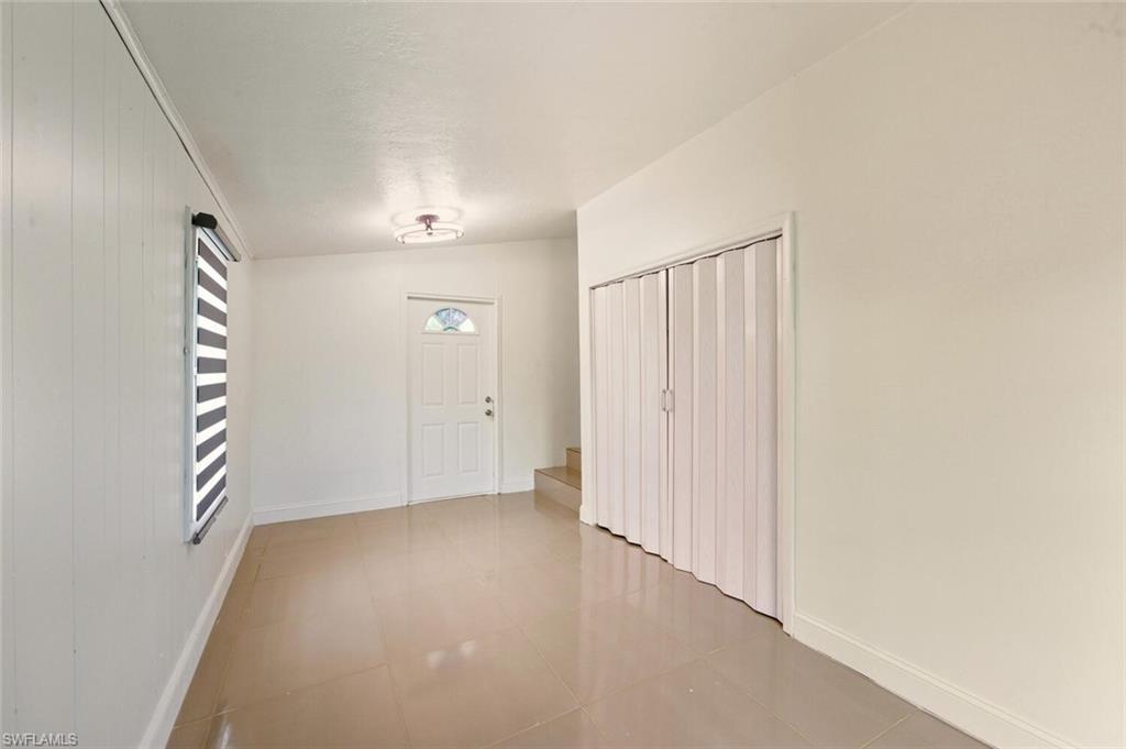 5317 Dixie Drive Naples, FL 34113 - Photo 25 of 36 an empty room with windows and closet