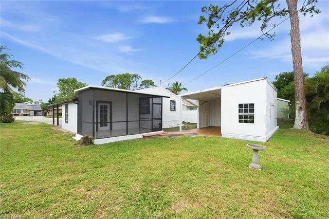 a view of a house with a yard