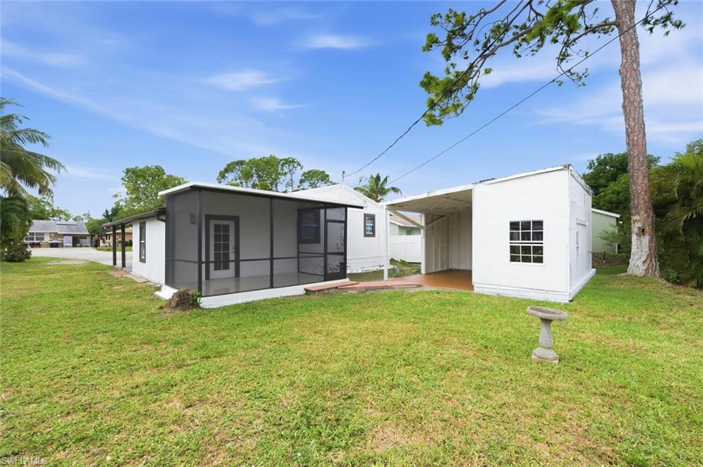5317 Dixie Drive Naples, FL 34113 - Photo 29 of 36 a view of a house with a yard