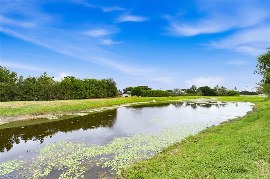 5317 Dixie Drive Naples, FL 34113 - Photo 33 of 36 a view of a lake with a city