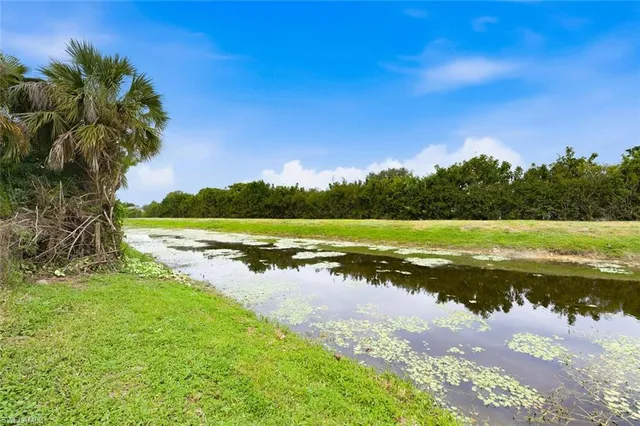 a view of a lake with a big yard