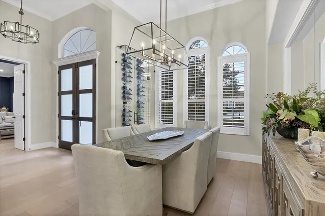 a living room with furniture and a book shelf