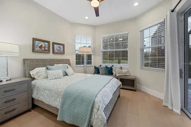 a bathroom with a granite countertop sink a large mirror and a shower