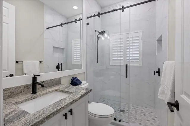 a room with gym equipment and windows