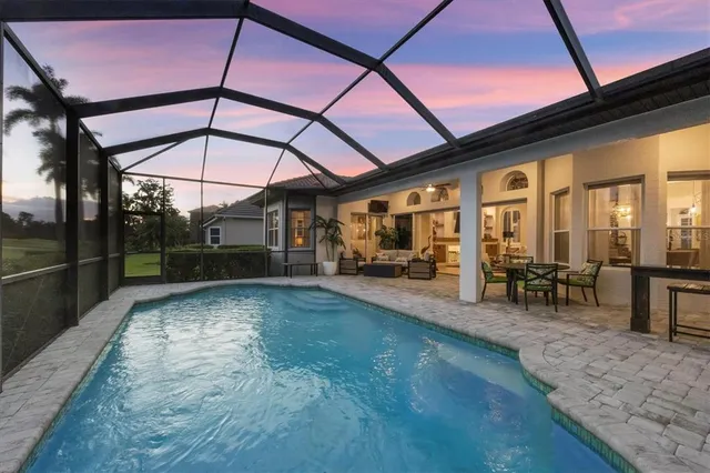a view of a backyard with sitting area