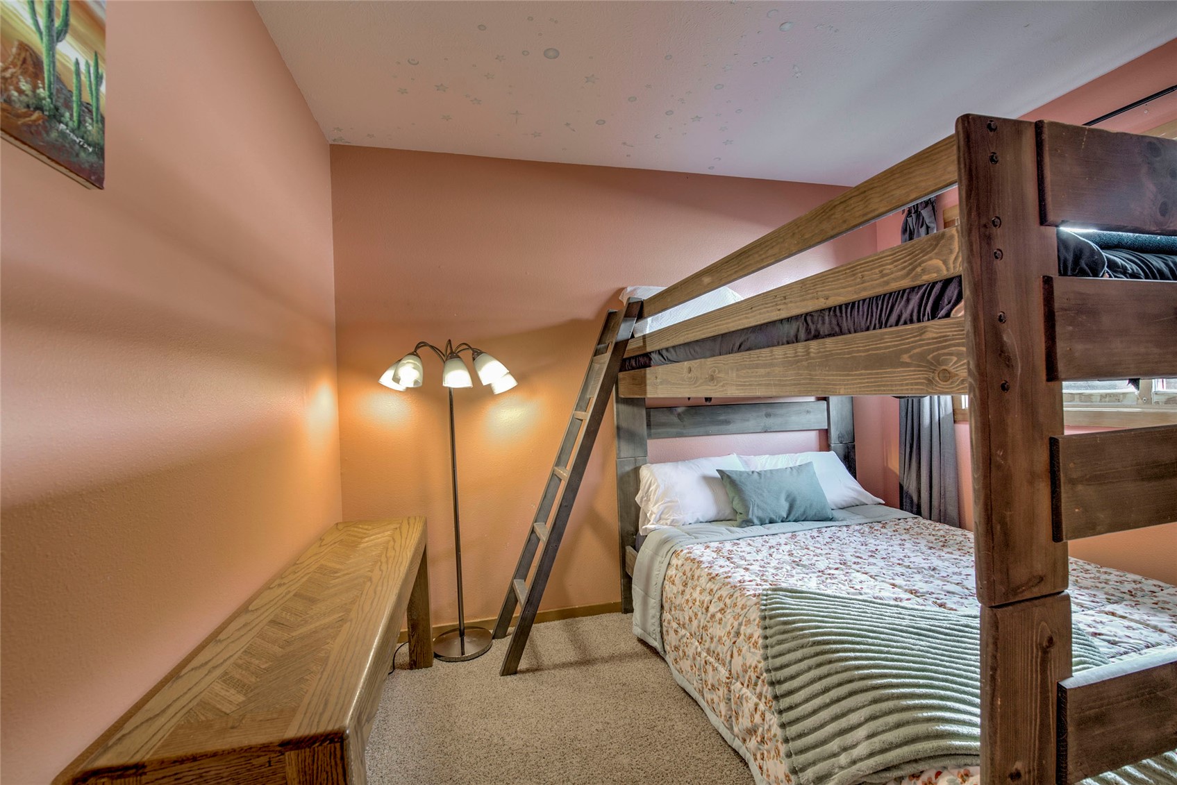 94300 Ryan Gulch Road, Unit 301 Silverthorne, CO 80498 - Photo 15 of 35 a bedroom with a bed and a mirror