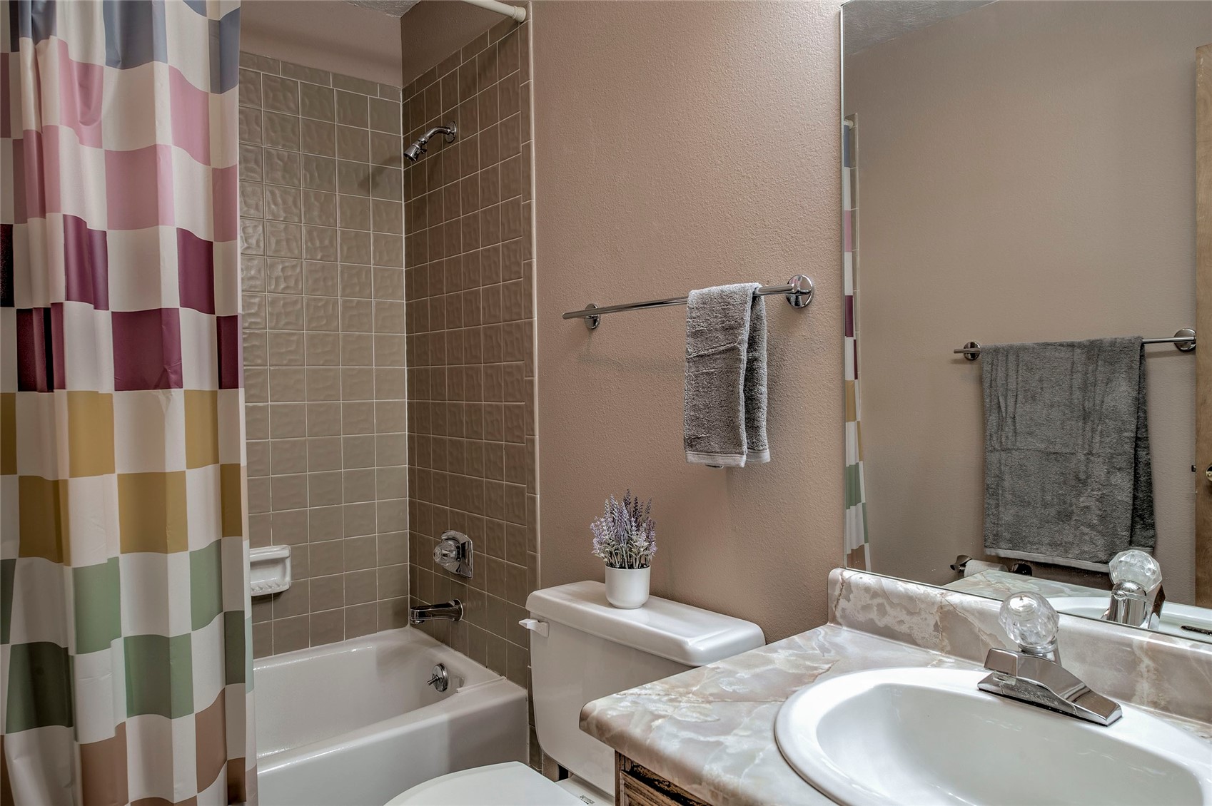 94300 Ryan Gulch Road, Unit 301 Silverthorne, CO 80498 - Photo 16 of 35 a bathroom with a sink toilet and shower