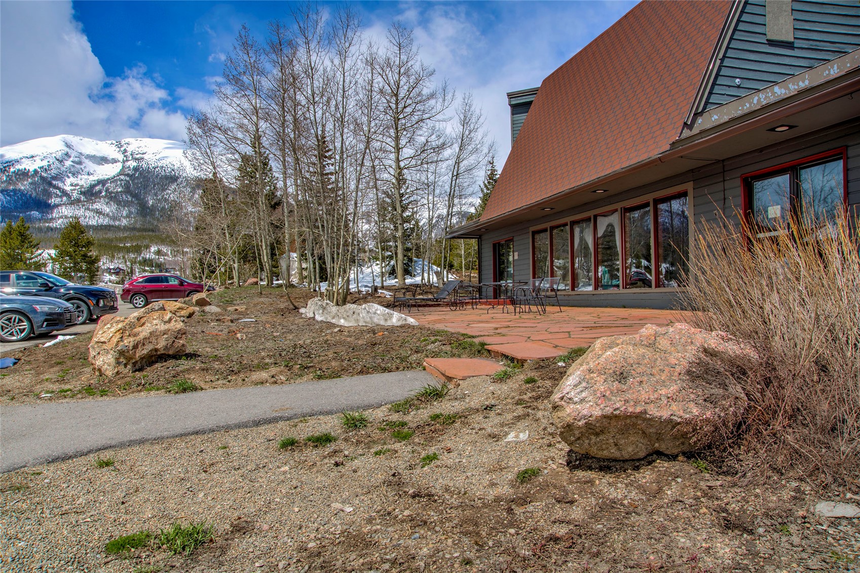 94300 Ryan Gulch Road, Unit 301 Silverthorne, CO 80498 - Photo 23 of 35 a view of a brick house with a sink and yard