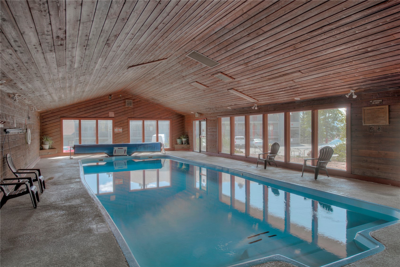 94300 Ryan Gulch Road, Unit 301 Silverthorne, CO 80498 - Photo 28 of 35 a view of a swimming pool with a patio
