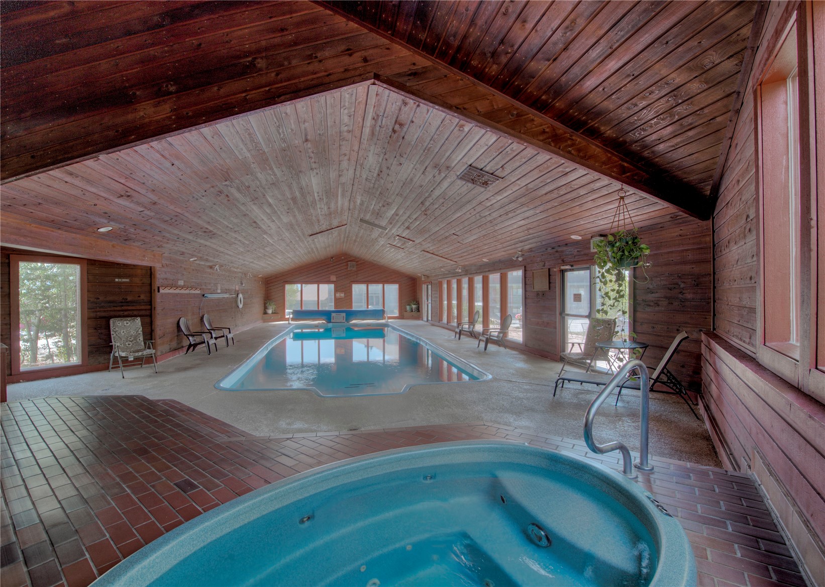 94300 Ryan Gulch Road, Unit 301 Silverthorne, CO 80498 - Photo 30 of 35 a view of a patio with table and chairs and potted plants