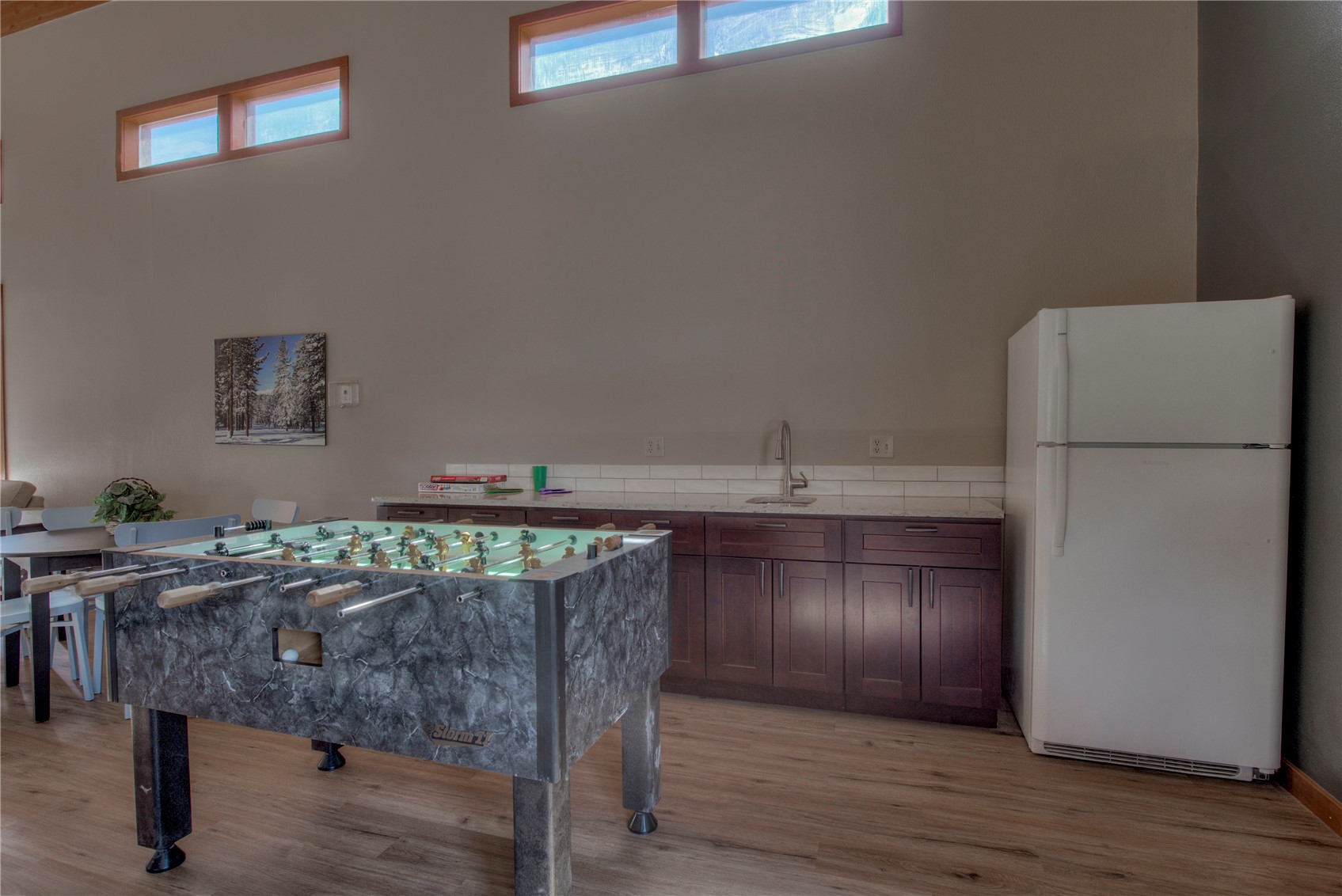 94300 Ryan Gulch Road, Unit 301 Silverthorne, CO 80498 - Photo 32 of 35 a kitchen with stainless steel appliances granite countertop a refrigerator and a stove