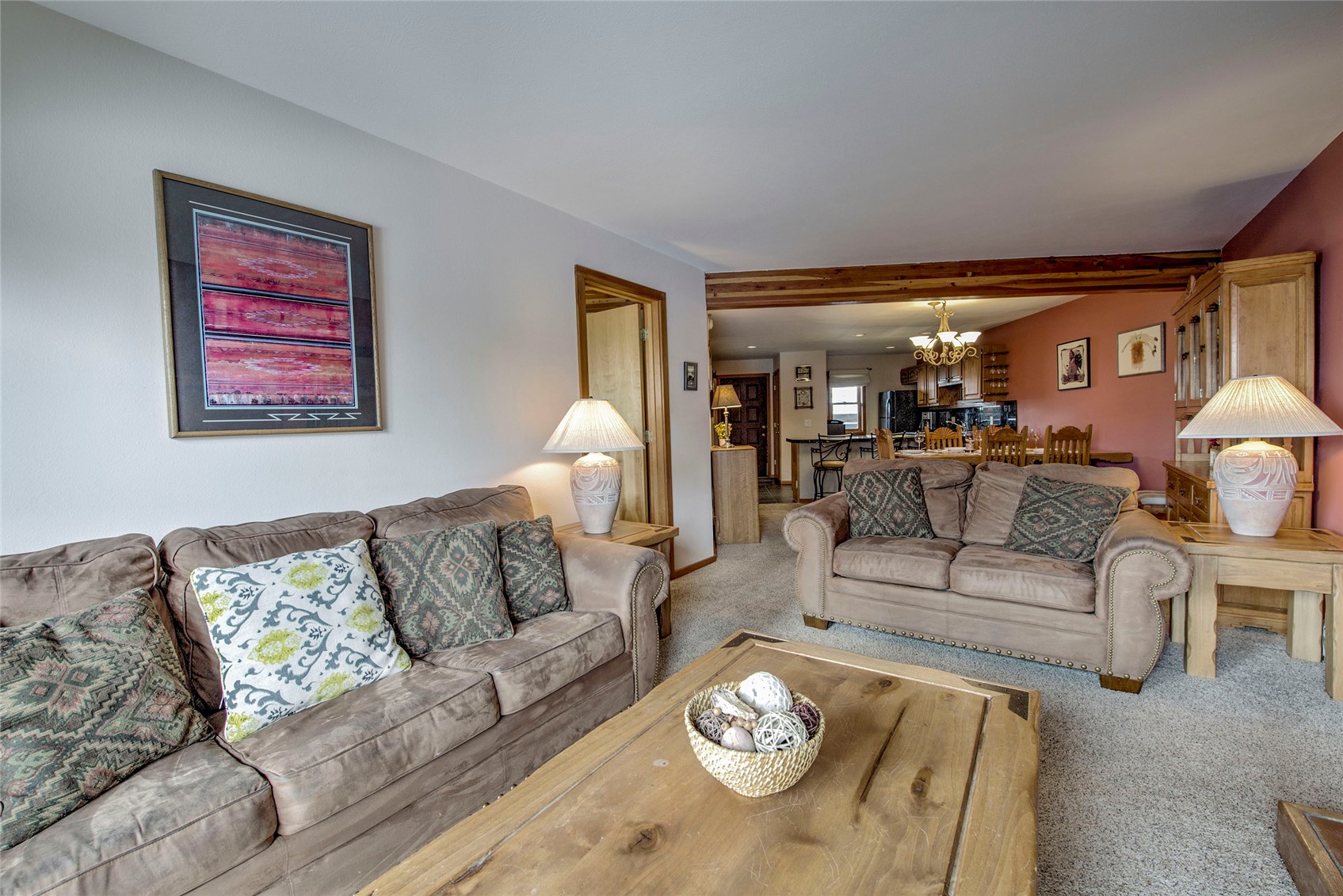 94300 Ryan Gulch Road, Unit 301 Silverthorne, CO 80498 - Photo 4 of 35 a living room with furniture and a couch