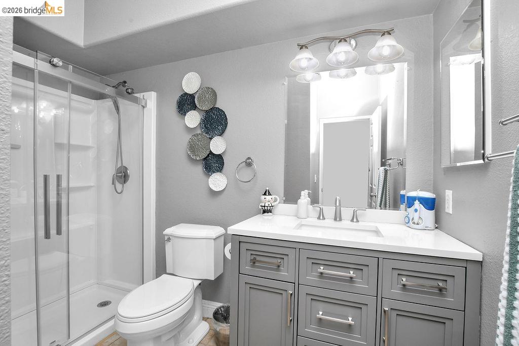 4229 Briones Valley Road Brentwood, CA 94513 - Photo 23 of 37 Bathroom with a stall shower, vanity, and a textured wall