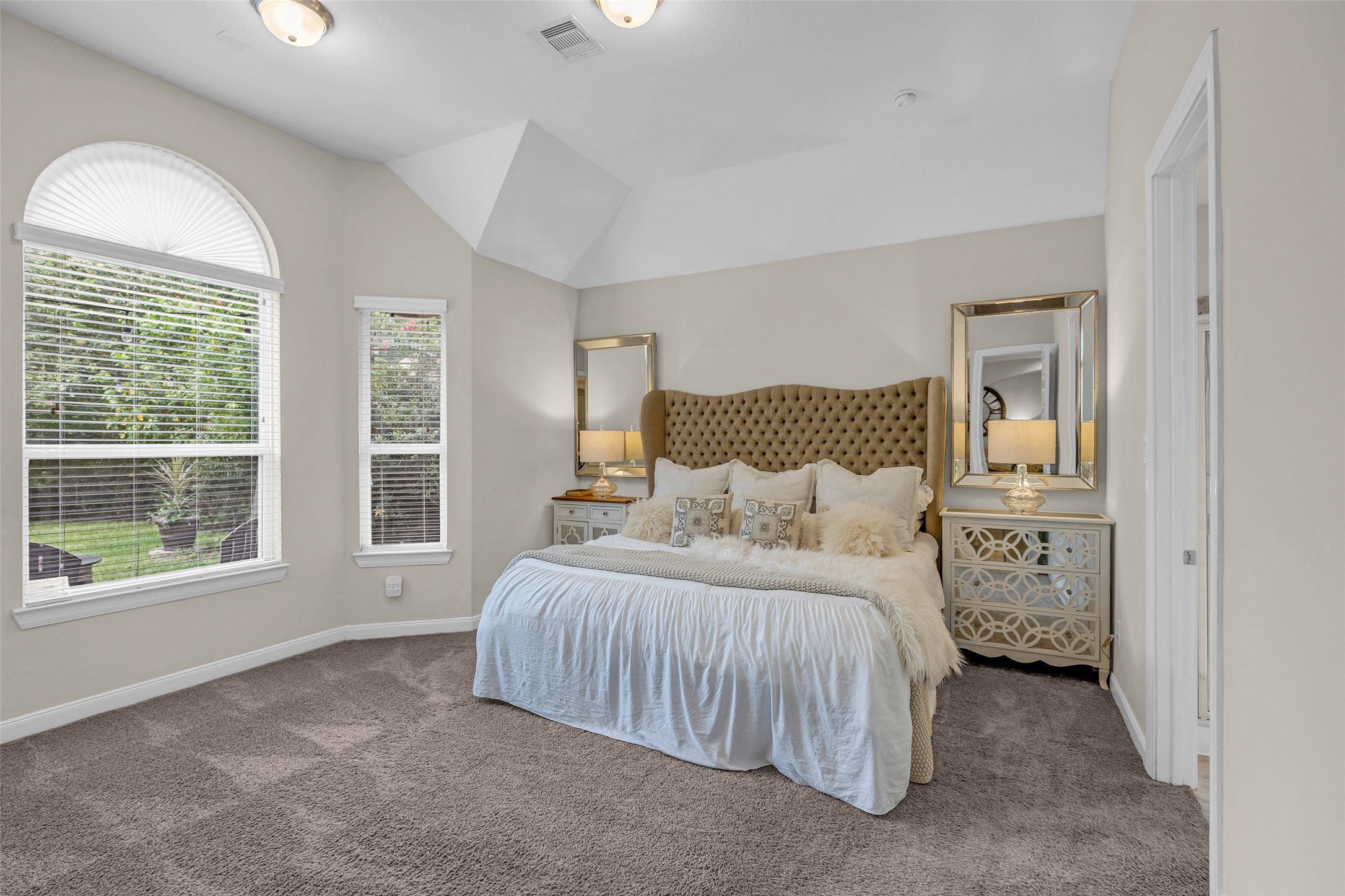 22419 Sawmill Ranch Drive Spring, TX 77389 - Photo 18 of 45 The spacious primary bedroom overlooks the backyard and offers space for large furniture or a sitting area.