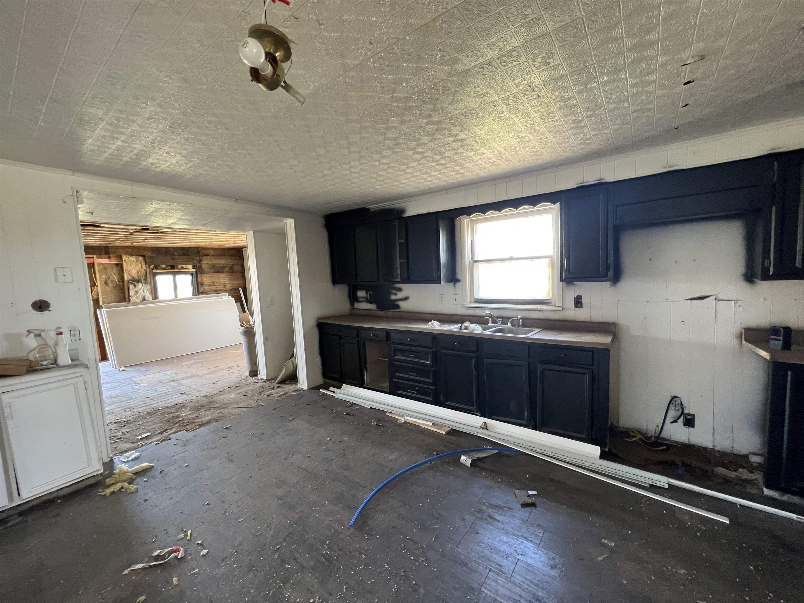 2857 Il Route Thomson, IL 61285 - Photo 7 of 30 a kitchen with a sink stove and cabinets
