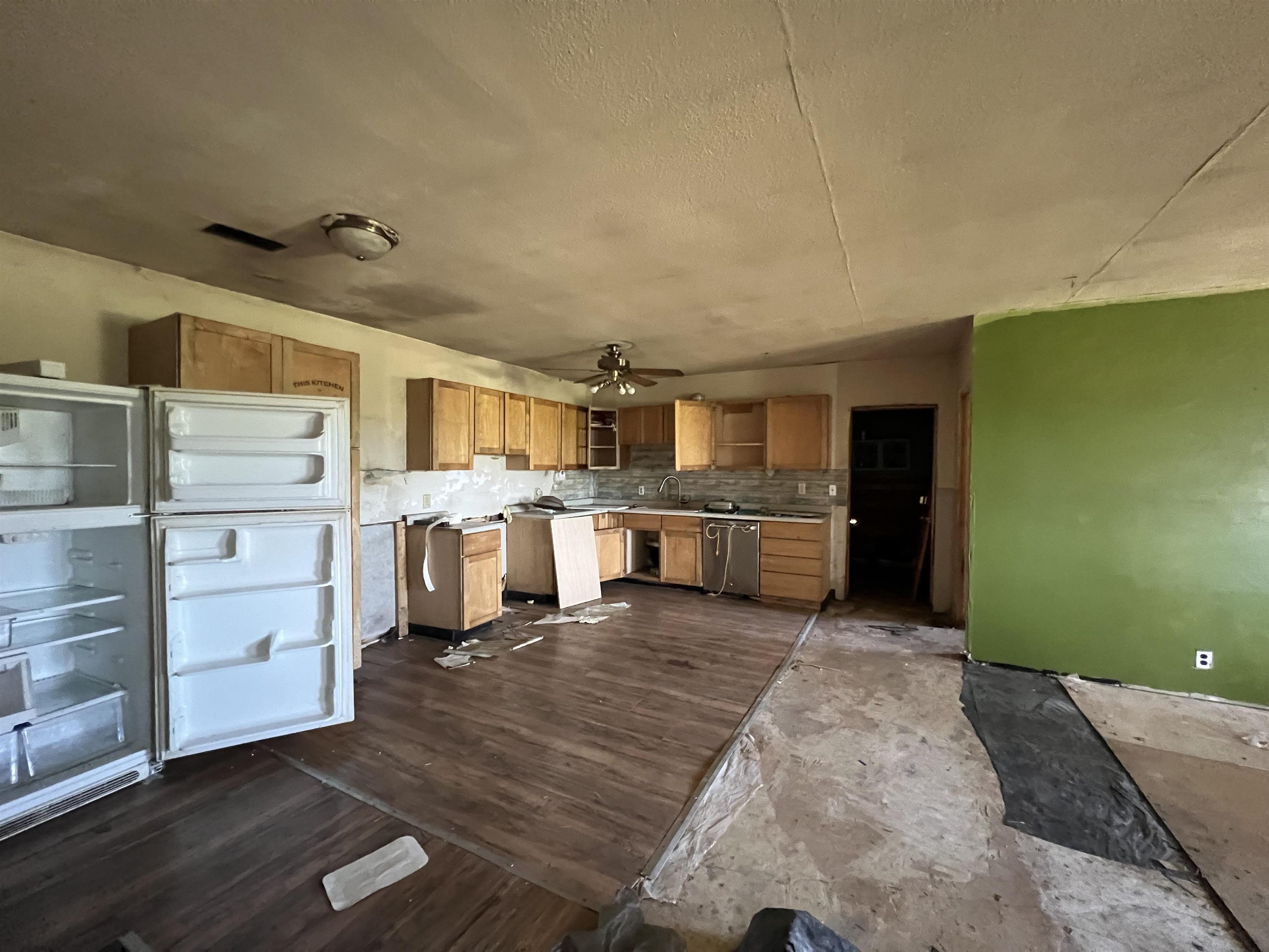 2857 Il Route Thomson, IL 61285 - Photo 8 of 30 a large kitchen with cabinets and a wooden floor