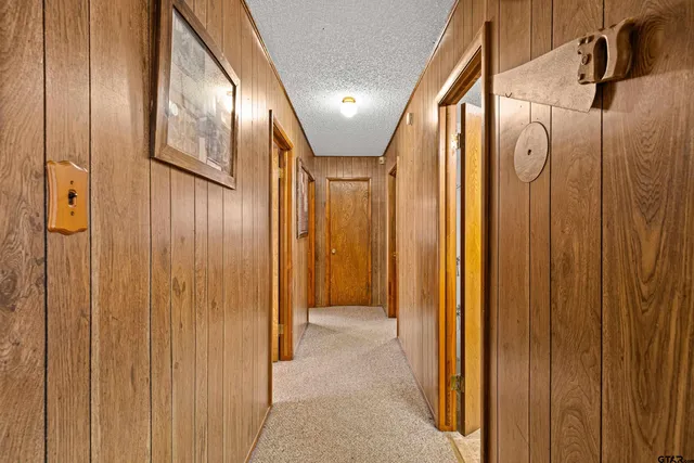 a bathroom with a sink and mirror with toilet