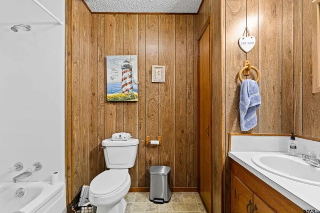 a livingroom with workspace and a window