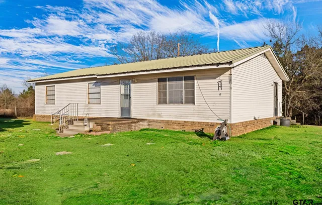 a view of a backyard with a garden