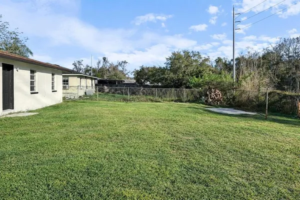 a backyard of a house with lots of green space