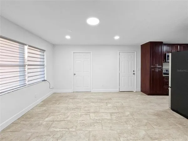 a view of an empty room with a window