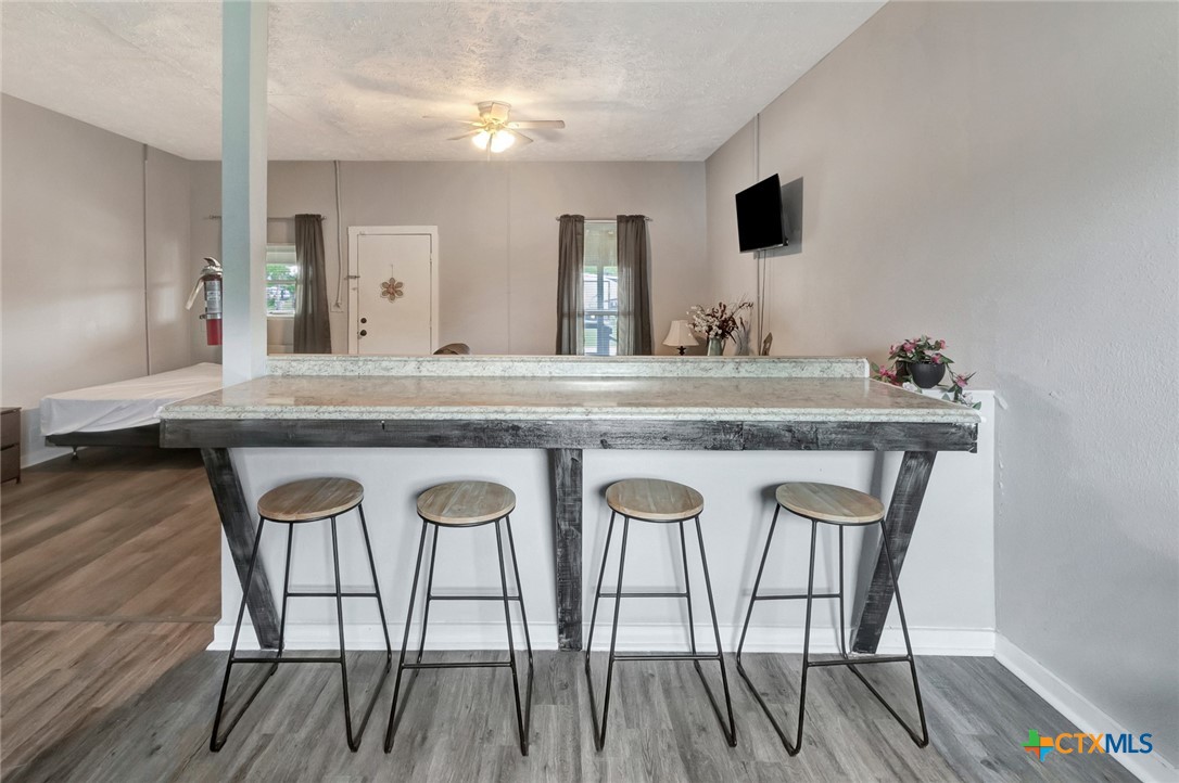 103 5th Street Seadrift, TX 77983 - Photo 4 of 18 a view of a chair and table in a kitchen