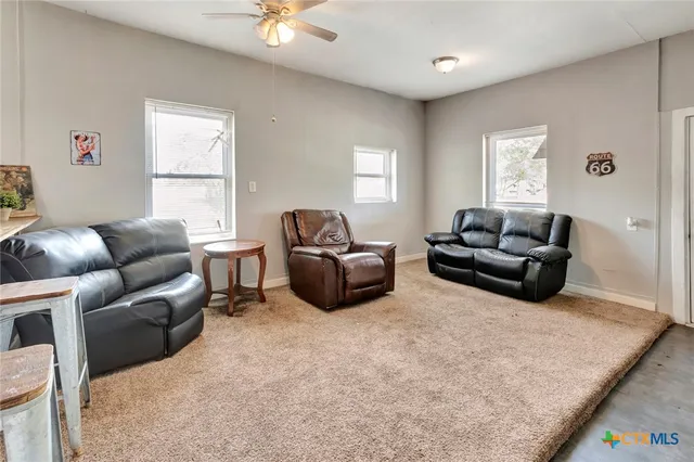 a living room with furniture and a window