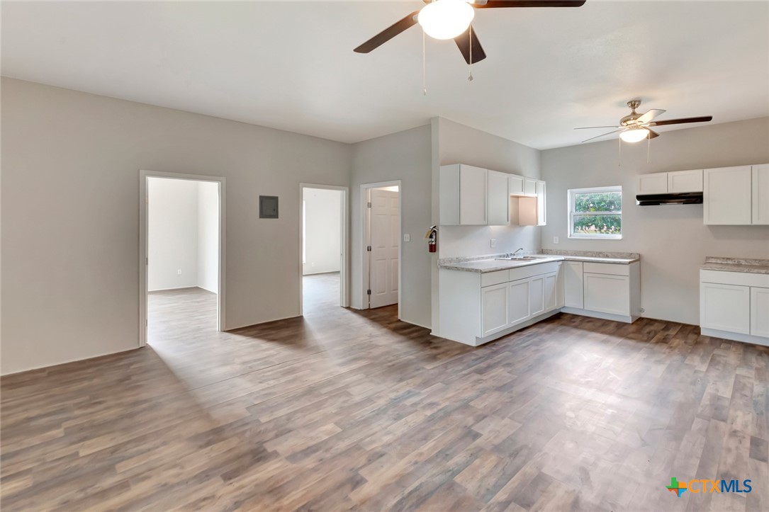 103 5th Street Seadrift, TX 77983 - Photo 10 of 18 a view of a kitchen with stove and cabinets