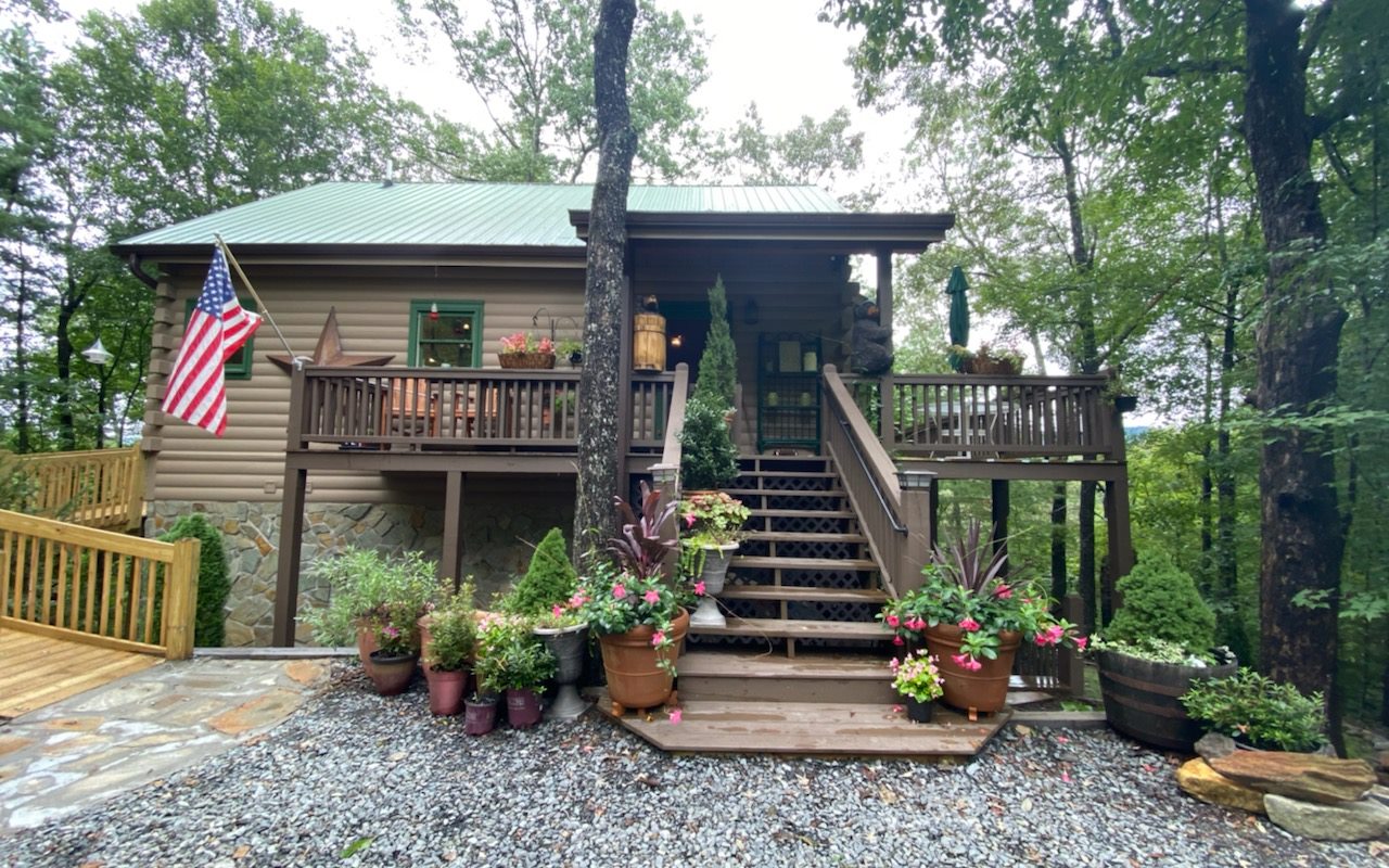133 Rocky Road Blue Ridge, GA 30513 - Photo 1 of 1 a front view of a house with a porch