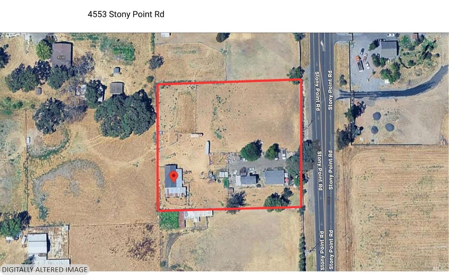 red outline of general property shape and size, tag shows barn at back of property.