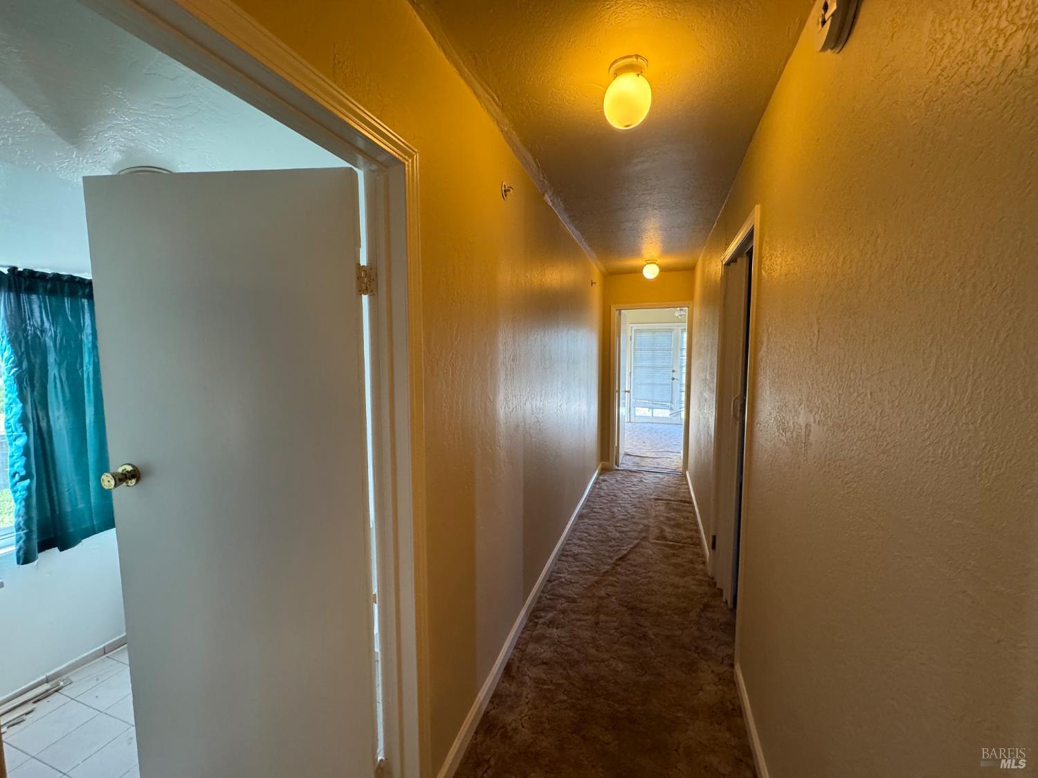 4553 Stony Point Road Santa Rosa, CA 95407 - Photo 15 of 26 upstairs hallway , bathroom to left bedroom to right and down to storage