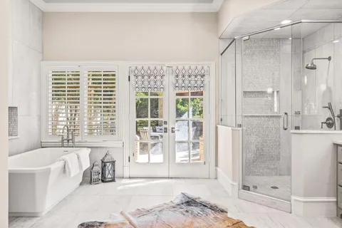 a spacious bathroom with a shower and a bathtub