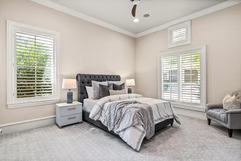 a bedroom with a bed and a couch