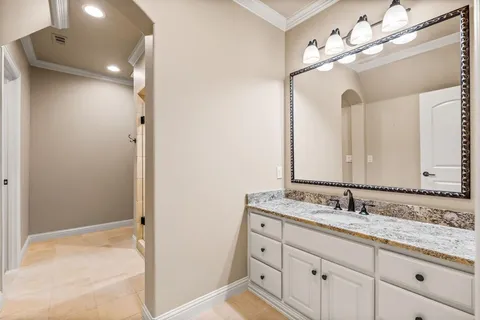 a bathroom with a sink vanity and a mirror