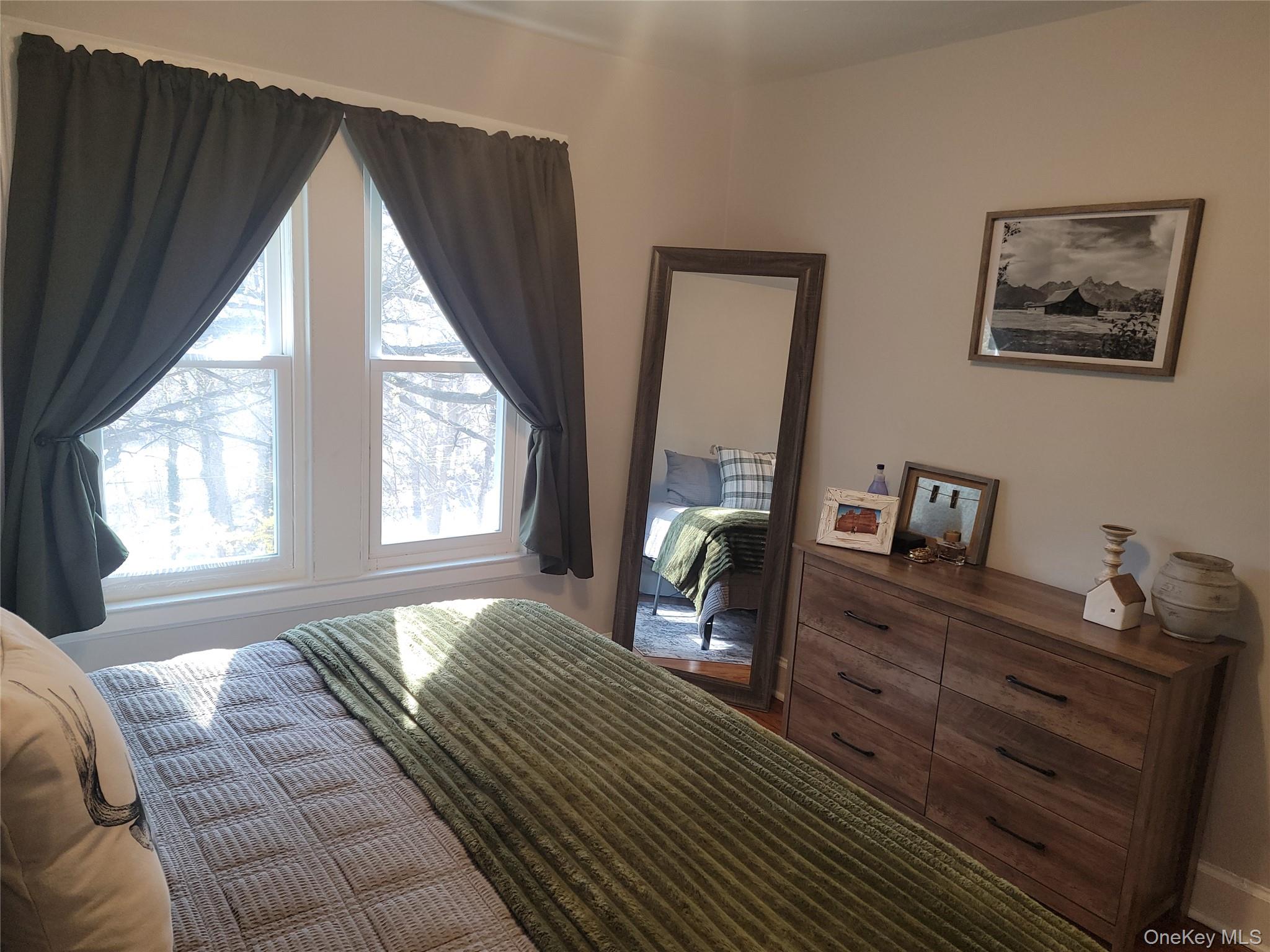 7 Stone Ridge Road Tuxedo Park, NY 10987 - Photo 20 of 33 a bedroom with a bed and wooden floor