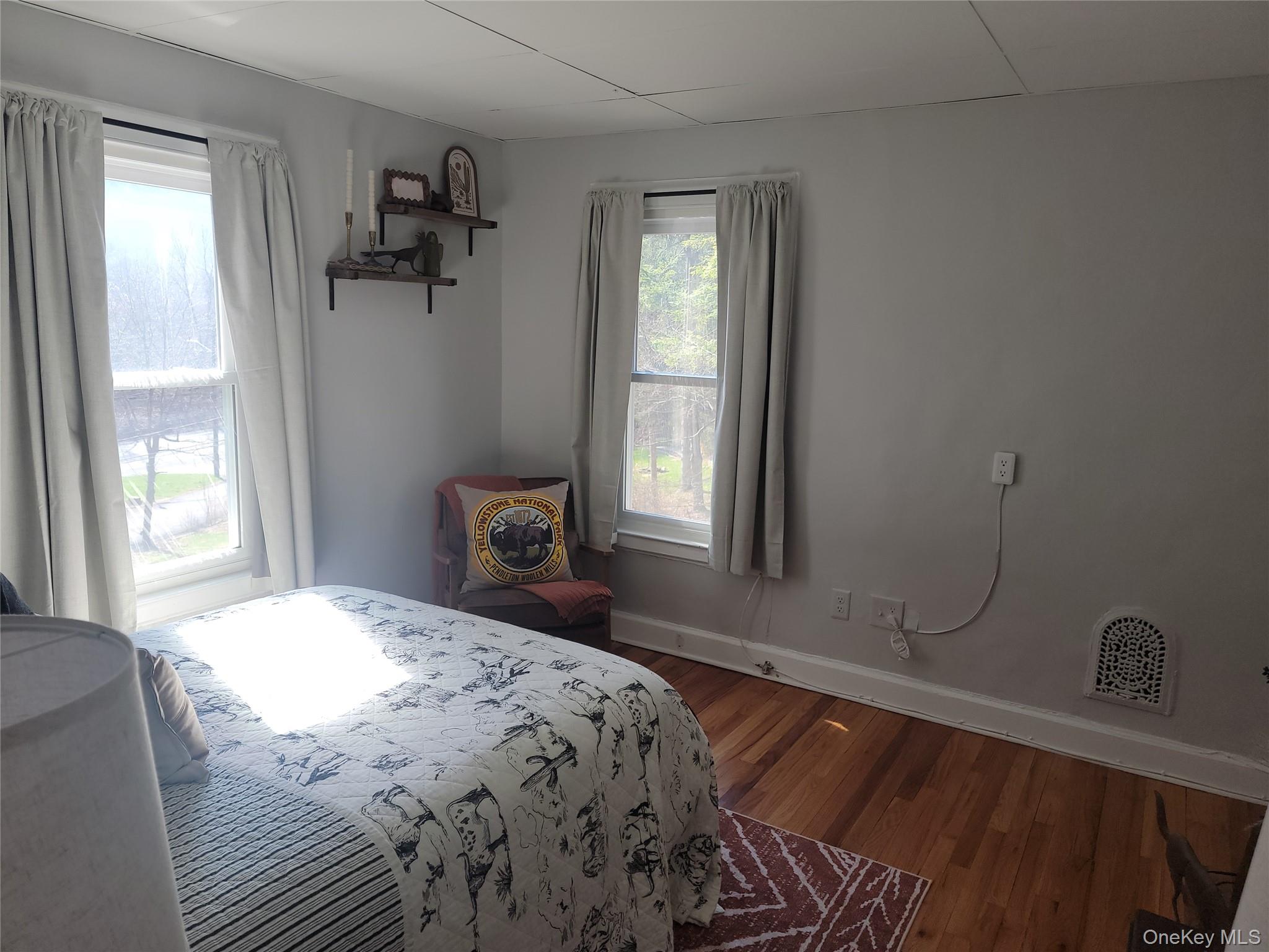 7 Stone Ridge Road Tuxedo Park, NY 10987 - Photo 21 of 33 a bedroom with a bed and a window