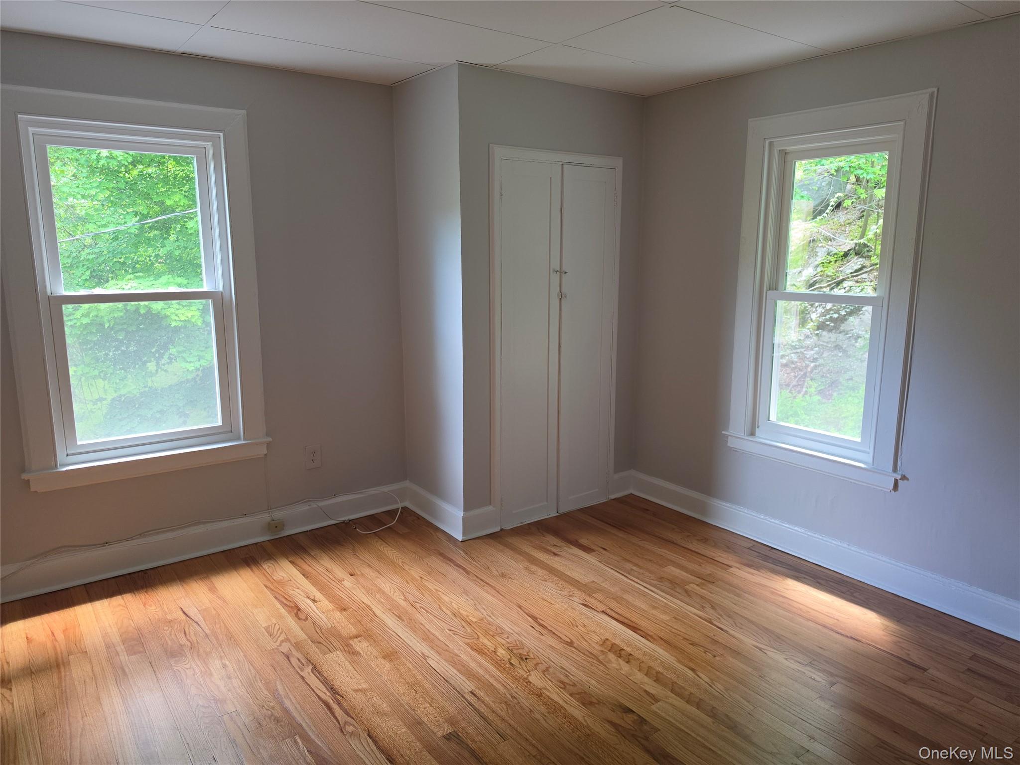 7 Stone Ridge Road Tuxedo Park, NY 10987 - Photo 22 of 33 a view of an empty room with wooden floor and a window