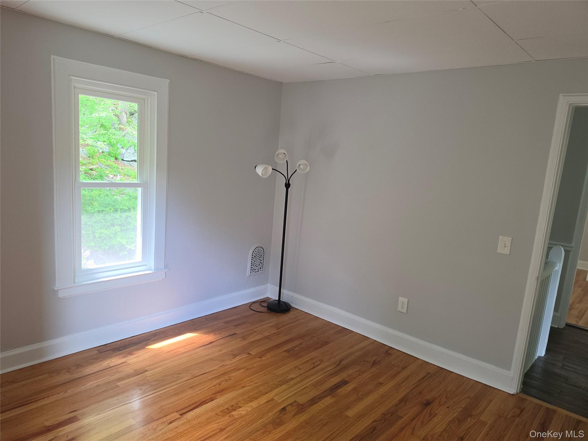 7 Stone Ridge Road Tuxedo Park, NY 10987 - Photo 23 of 33 an empty room with wooden floor and windows