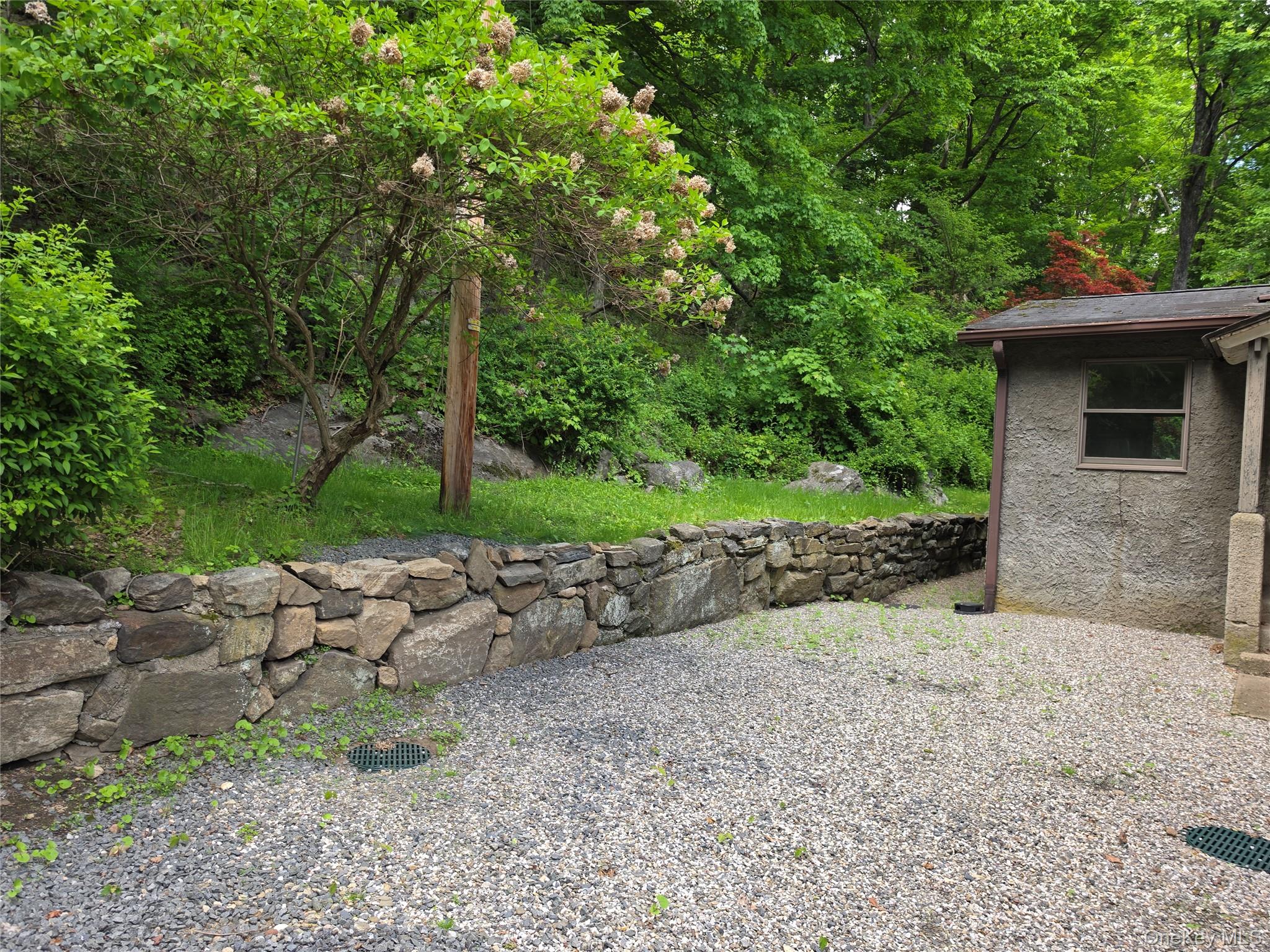 7 Stone Ridge Road Tuxedo Park, NY 10987 - Photo 33 of 33 a view of a yard with plants and trees